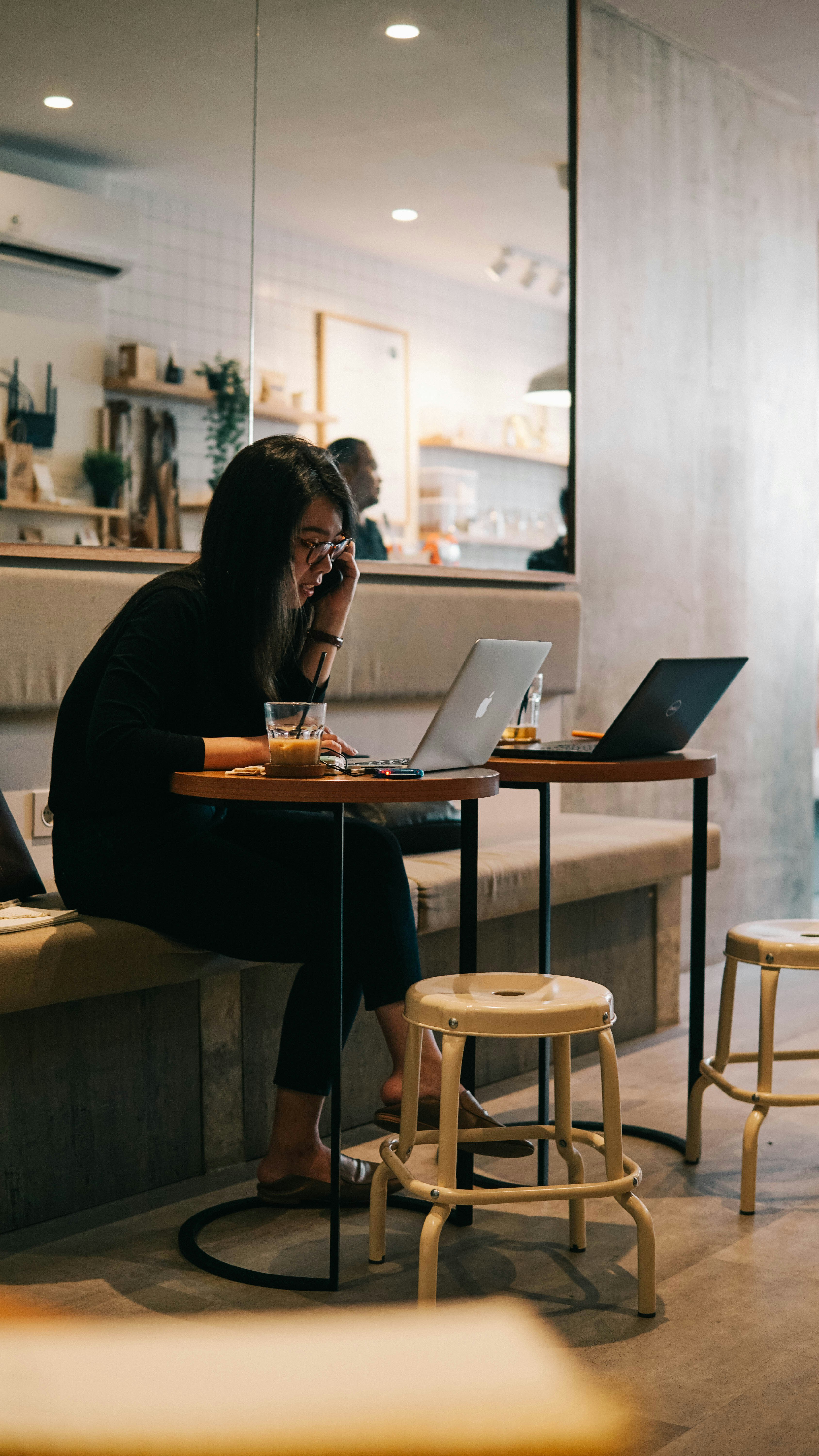 woman in black long sleeve shirt using macbook